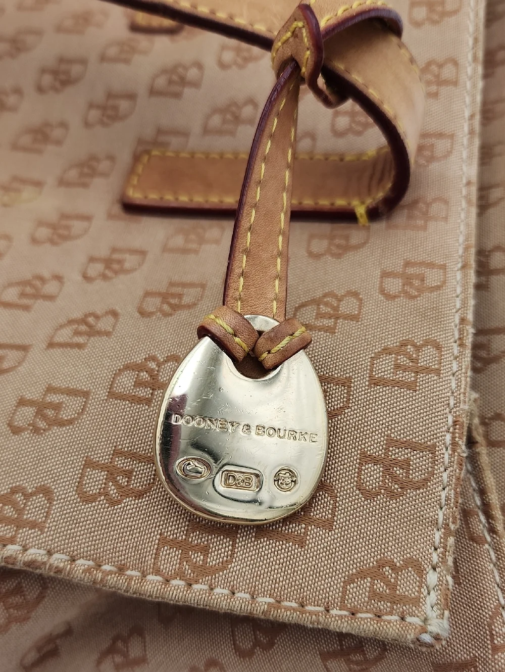 Dooney & Bourke Signature Monnogram Brown And Pink Satchel Bag‎